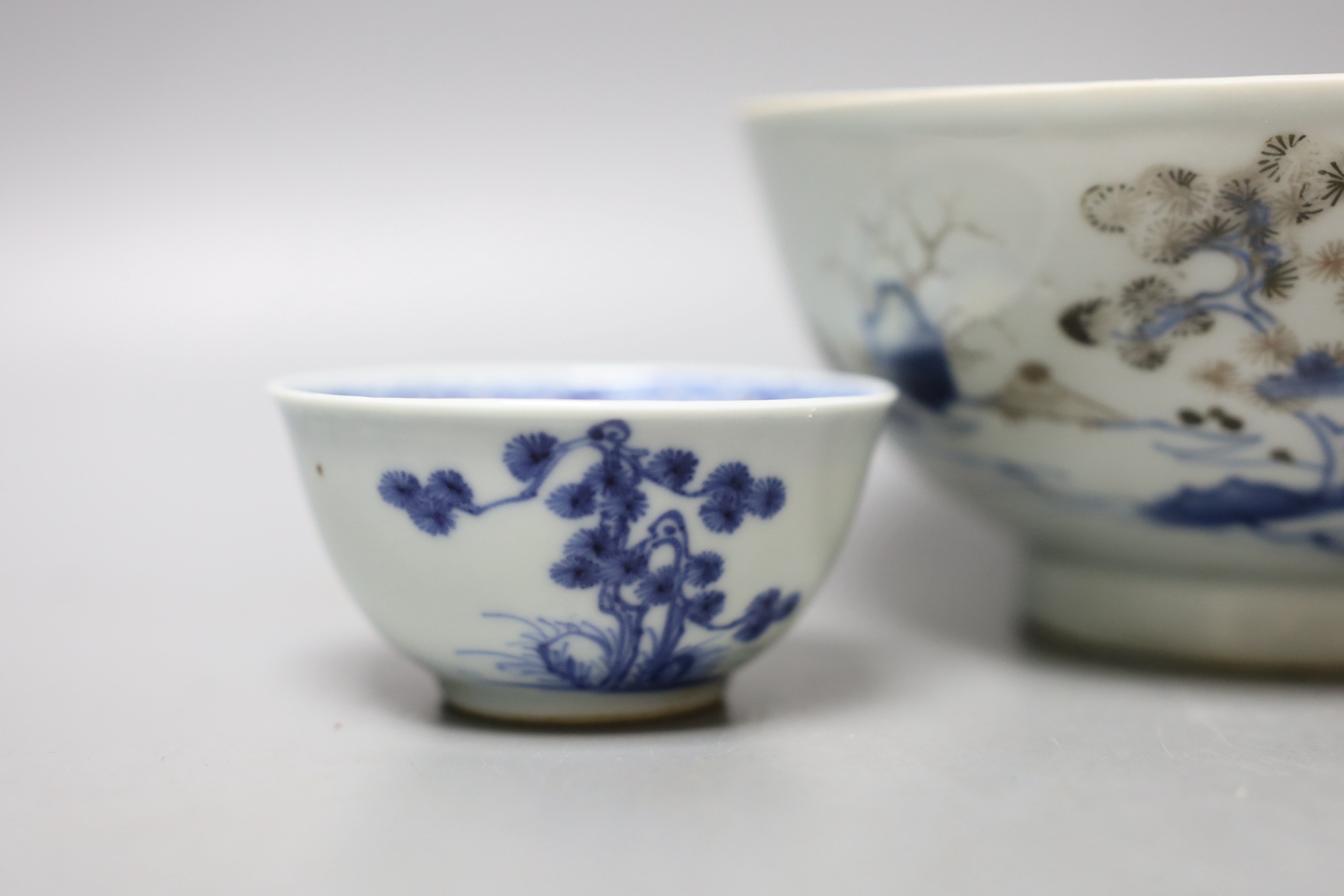 A Chinese Nanking cargo blue and white bowl and a tea bowl and saucer (Christie's label on base)